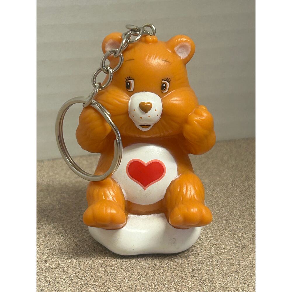 vintage Tenderheart Bear custom-made keychain sitting on a white cloud figurine